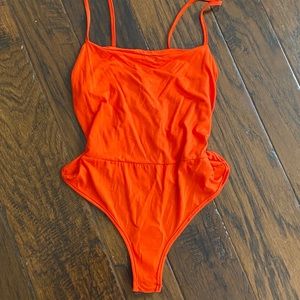 Prettylittlething orange bodysuit